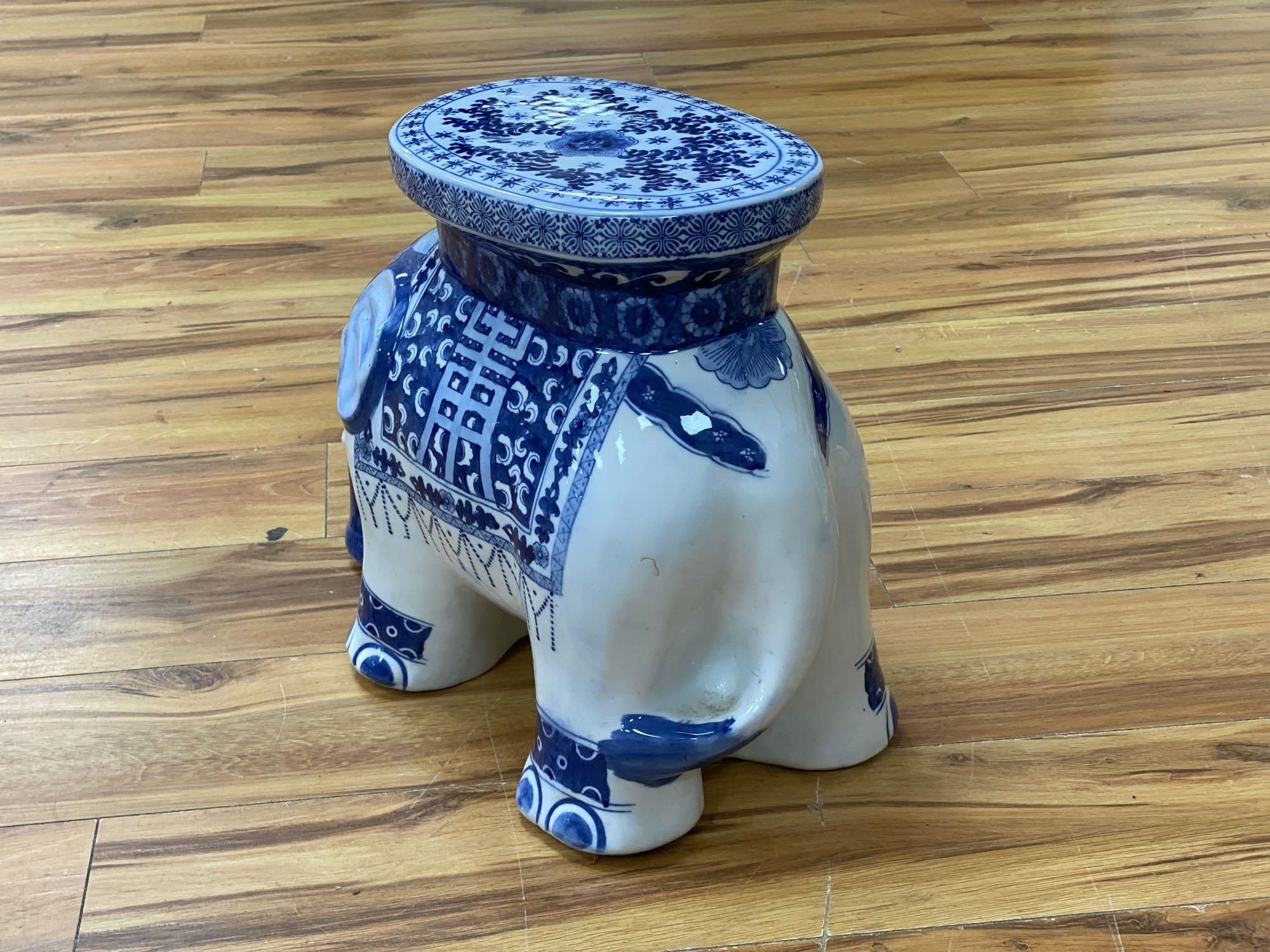 A Chinese blue and white ceramic garden seat and a similar elephant seat, 47.5cm tall